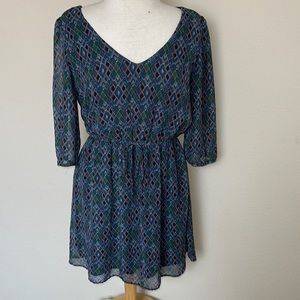 Boho vibes in this flowing dress with cinched waist